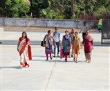Students enter the campus along with parents. 