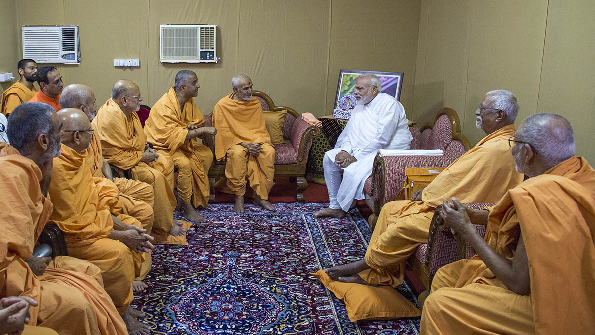 PM Modi meets HH Mahant Swami and senior sadhus, with CM Rupani