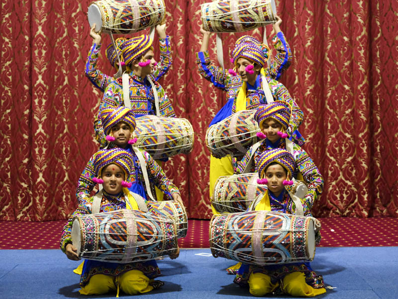Children perform a cultural dance in the welcome assembly