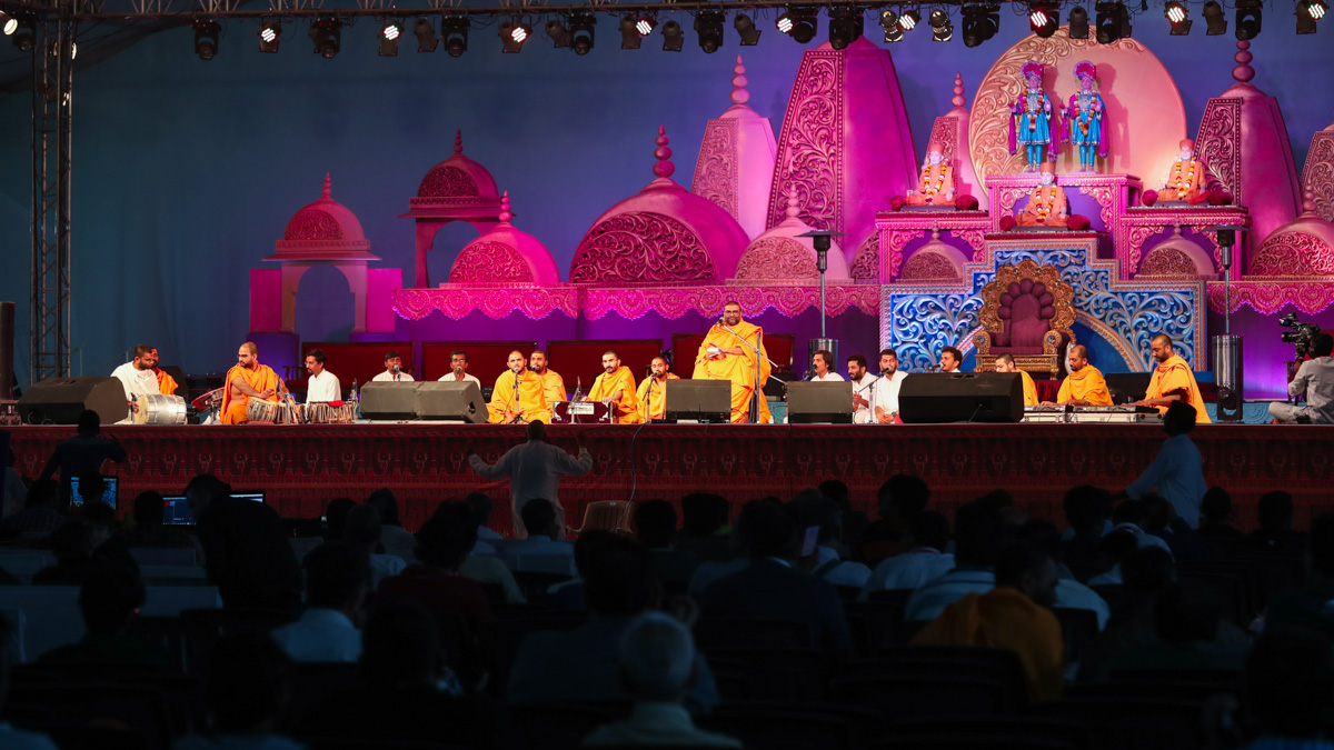 Sadhus and youths sing kirtans