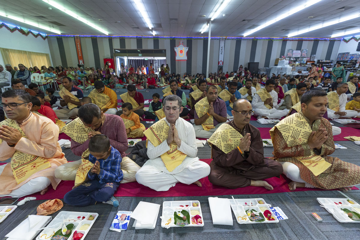 Devotees participate in mahapuja rituals