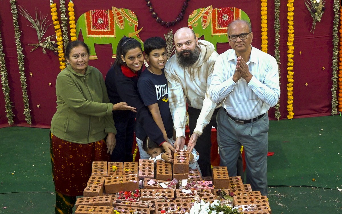 Devotees Place Their Worshiped Bricks