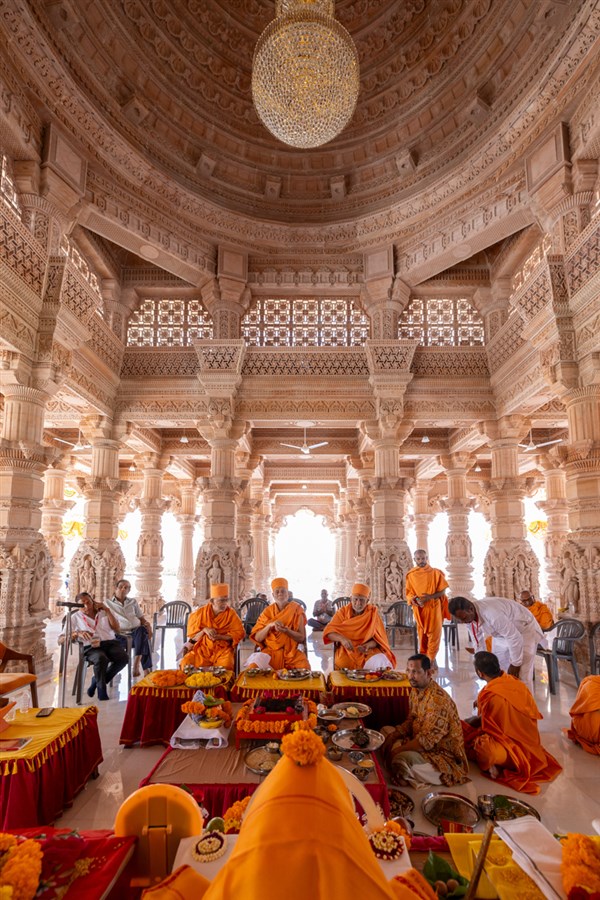 Senior swamis perform the vastu pujan rituals