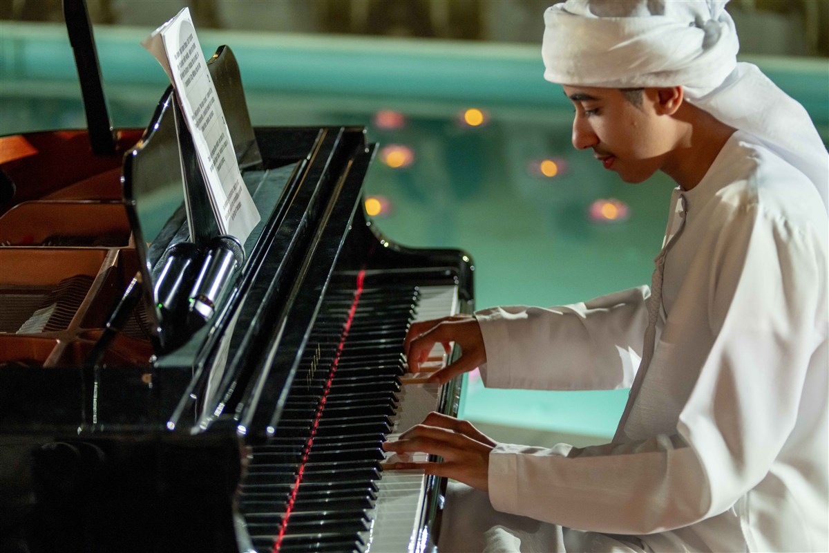 Once challenged in verbal expression, Ahmed discovered his voice through music, a universal language that bridges differences and inspires all.
