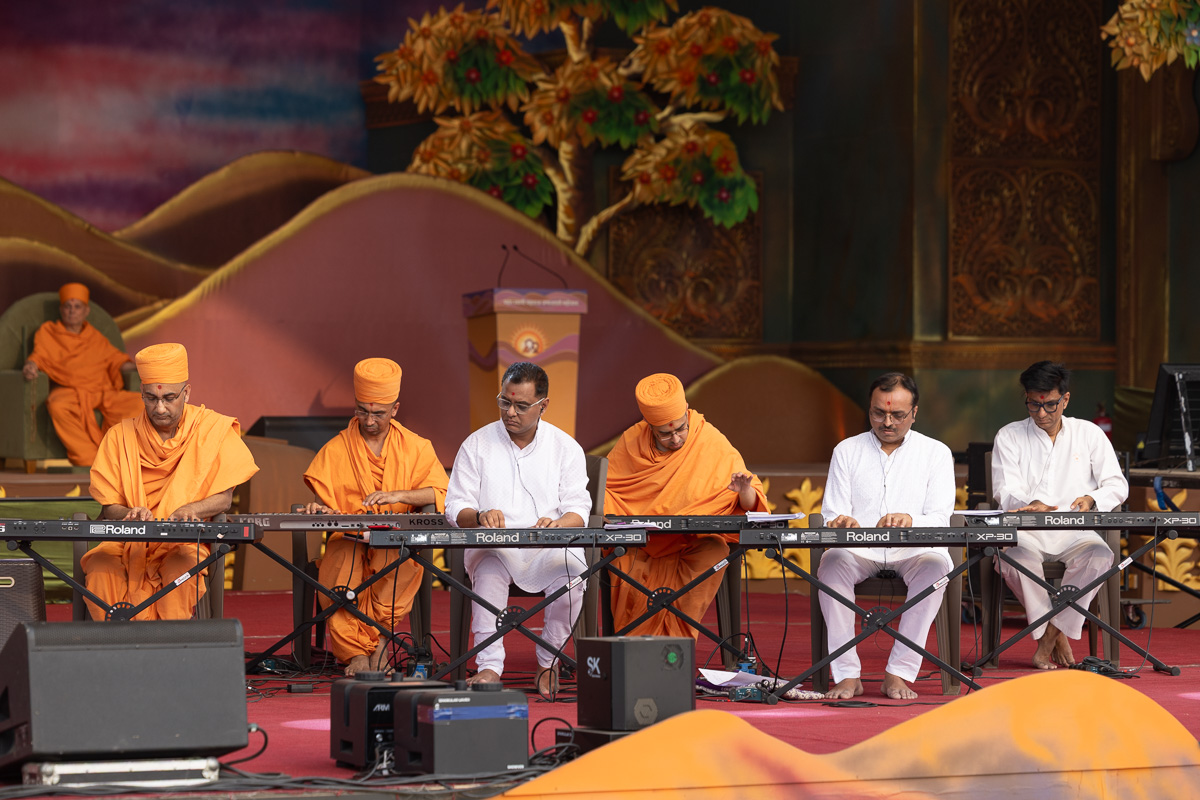 Swamis and devotees play the musical instruments