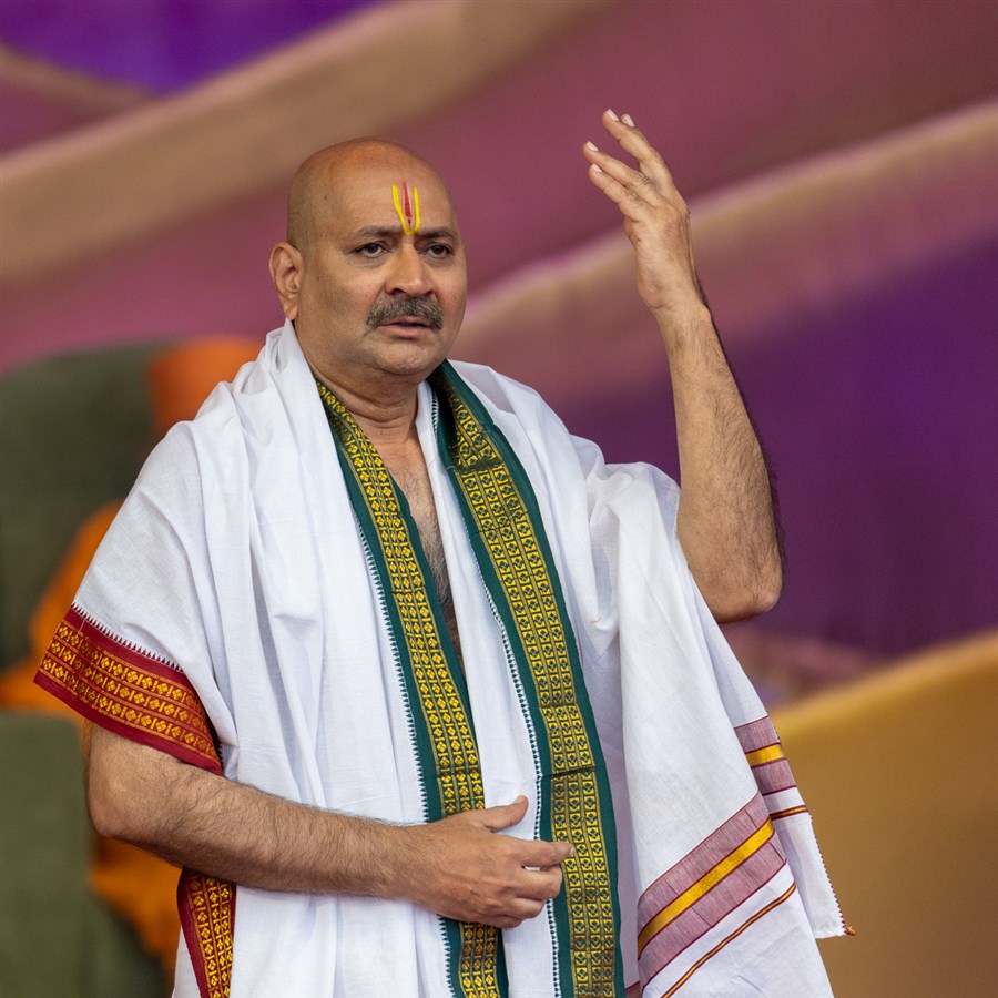 A devotee presents in the assembly
